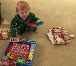 Constantine opening presents at his grandparents' home in Florida